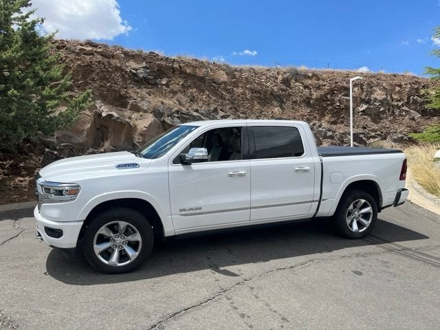 2021 RAM 1500 Limited in Ivory White Tri-Coat Pearlcoat — front three-quarter view