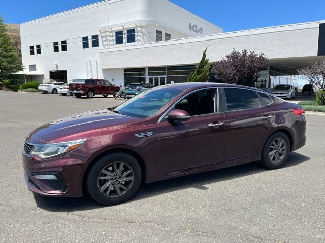 2020 Kia Optima LX in Sangria — front three-quarter view